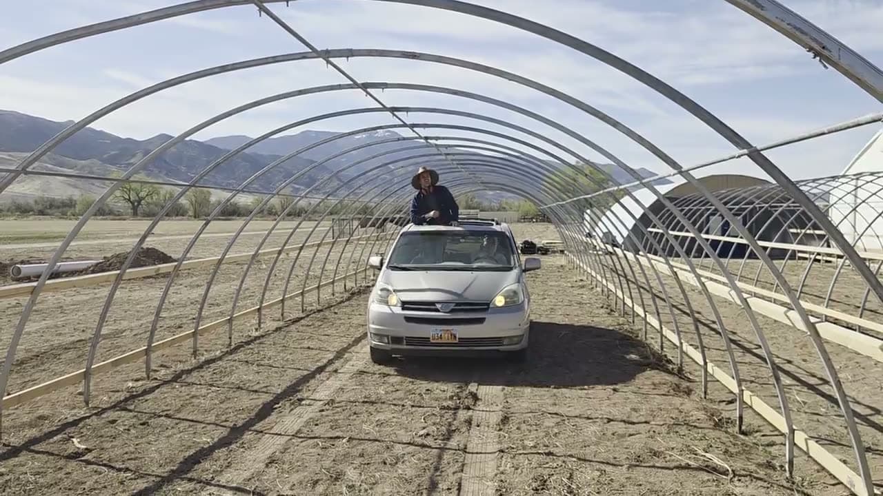 Driving past a purlin run during the greenhouse build